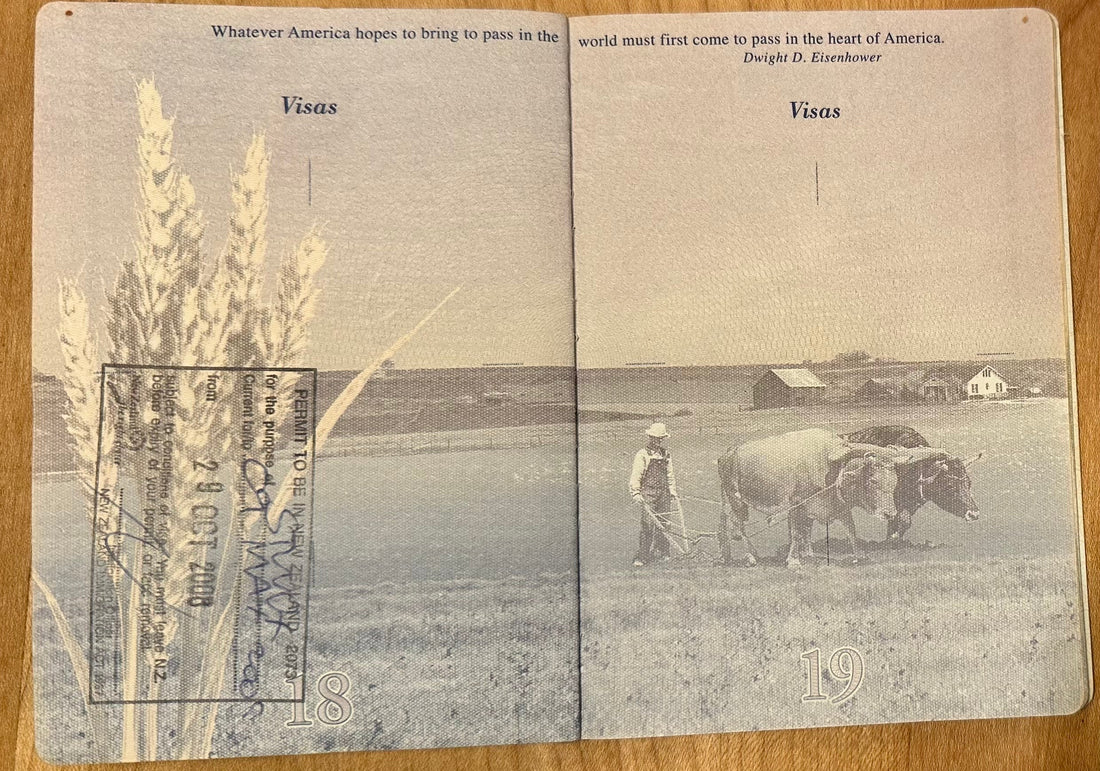 passport photo showing oxen working in a field with wheat seed heads in foreground and covered by a stamp granting Chanterelle entry into New Zealand where she discovered Sumisansui sumisoaker irrigation