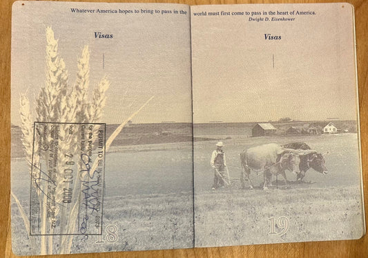 passport photo showing oxen working in a field with wheat seed heads in foreground and covered by a stamp granting Chanterelle entry into New Zealand where she discovered Sumisansui sumisoaker irrigation