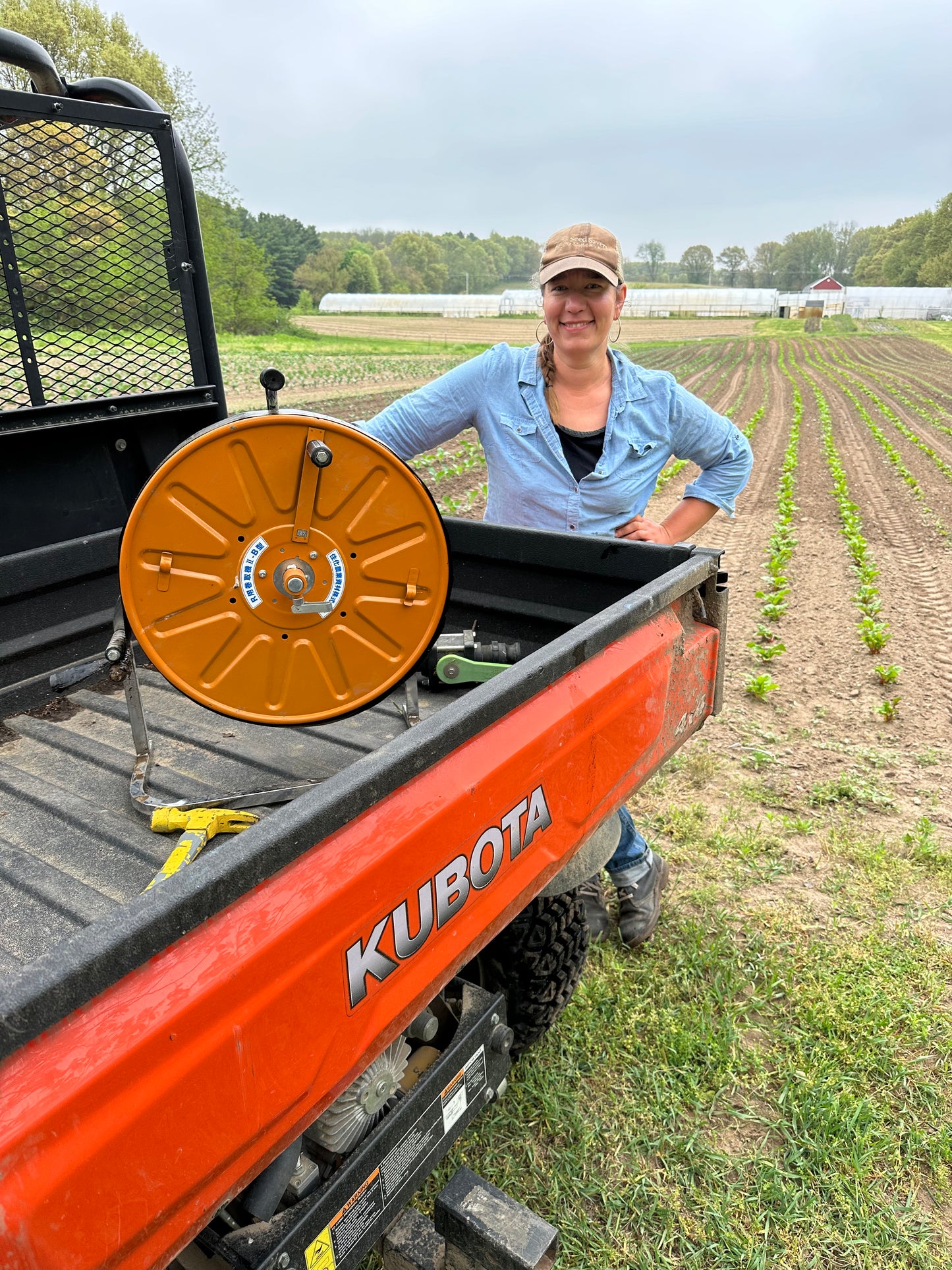 Chanterelle with her Sumisansui R-wide irrigation tube rolled up on the winder and ready to move to the next spot. sumi soaker sumisoaker max
